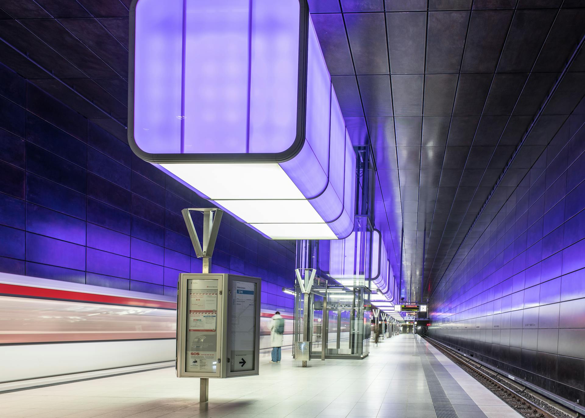 Explore the illuminated futuristic architecture of a modern metro station in Hamburg, Germany.