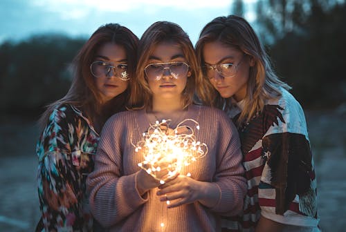 Photo of Three Women Wearing Eyeglasses