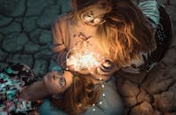 High-angle Photo of Two Women with String Lights