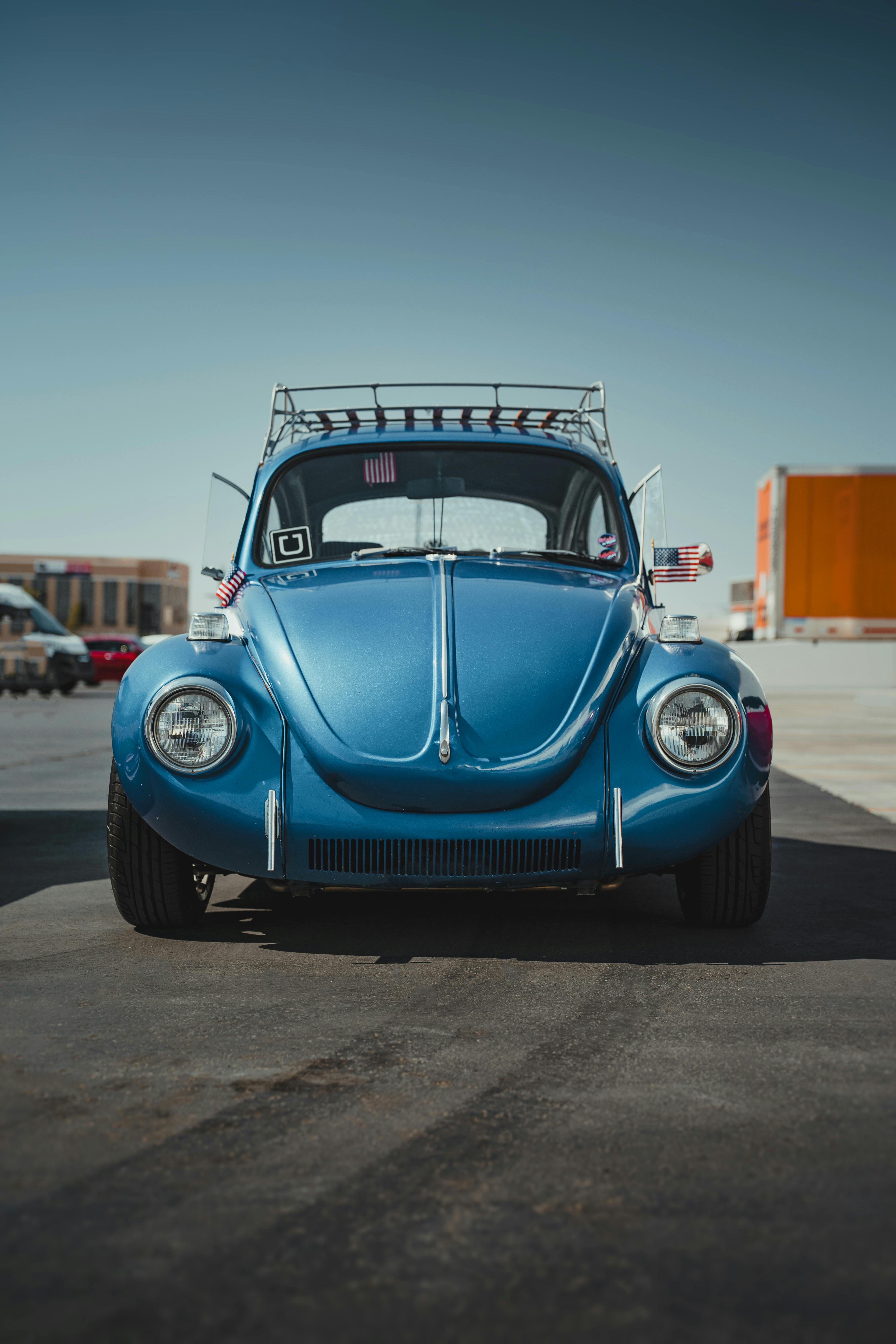 Classic blue Volkswagen Beetle parked outdoors in Las Vegas under a clear sky.