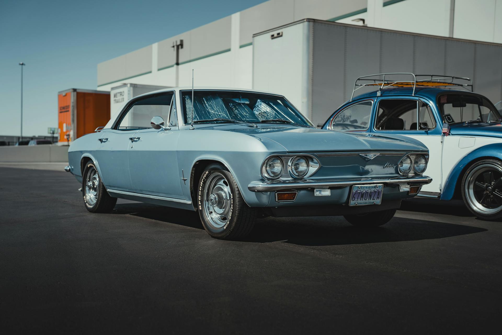 A Blue Vintage Car on a Parking Lot