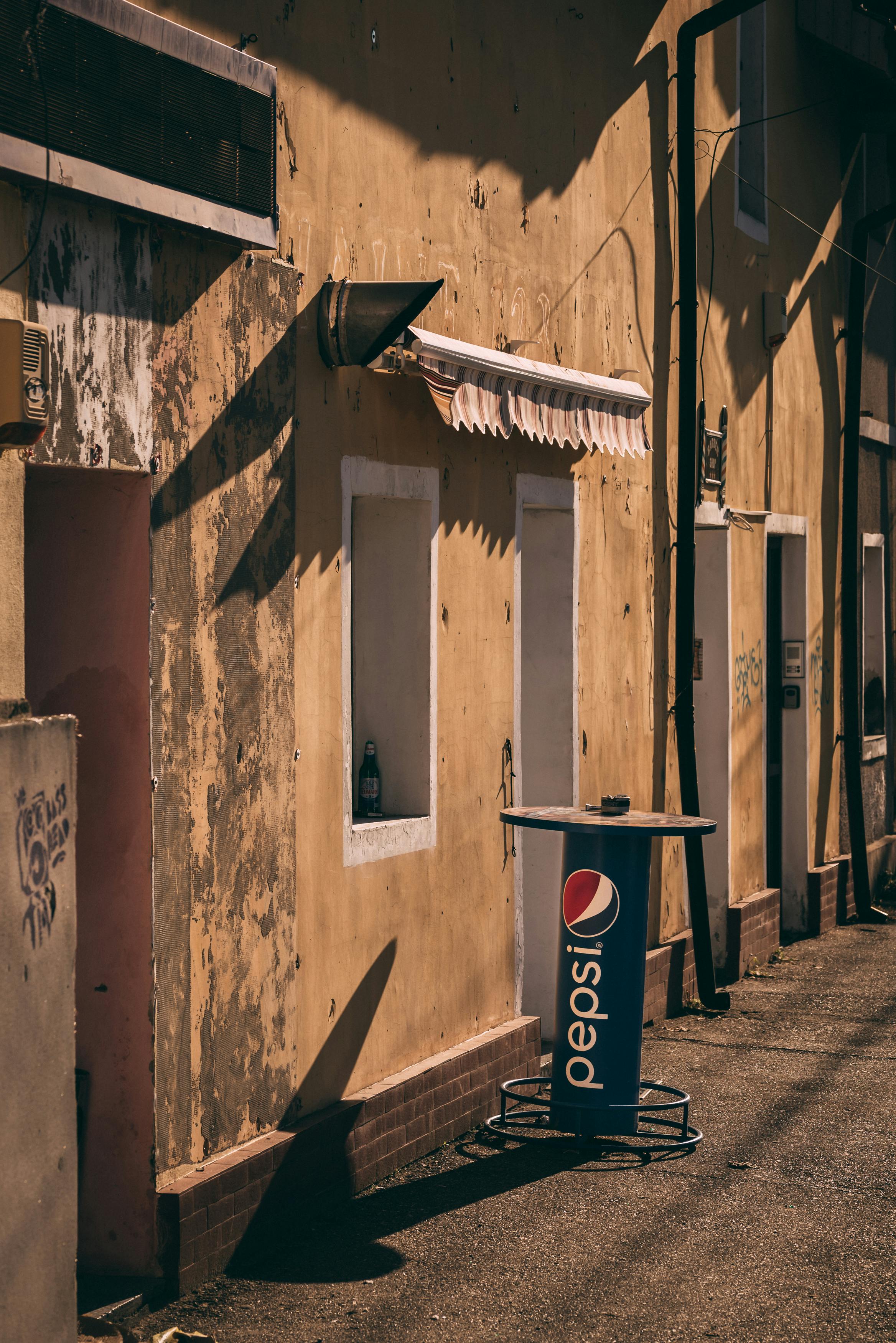 a pepsi sign on a wall