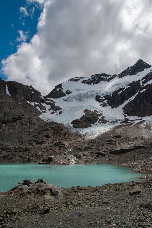 Free Stunning view of a glacial lake with rocky terrain and snowy peaks in Ushuaia, Argentina. Stock Photo