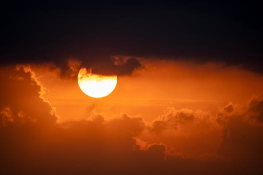 Stunning sunset in Nelson, WI with dramatic clouds and golden hues.