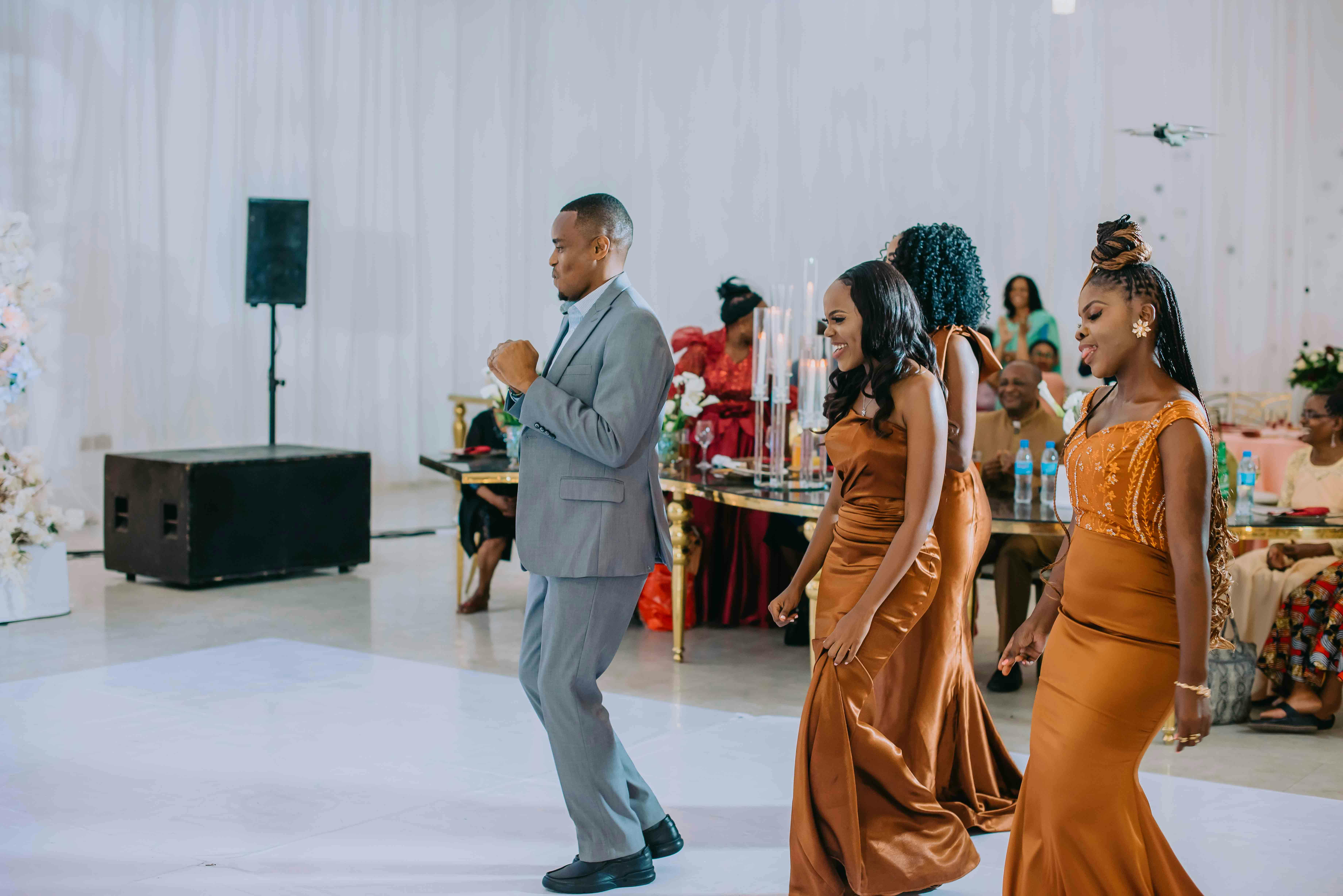 A group of people dancing at a wedding