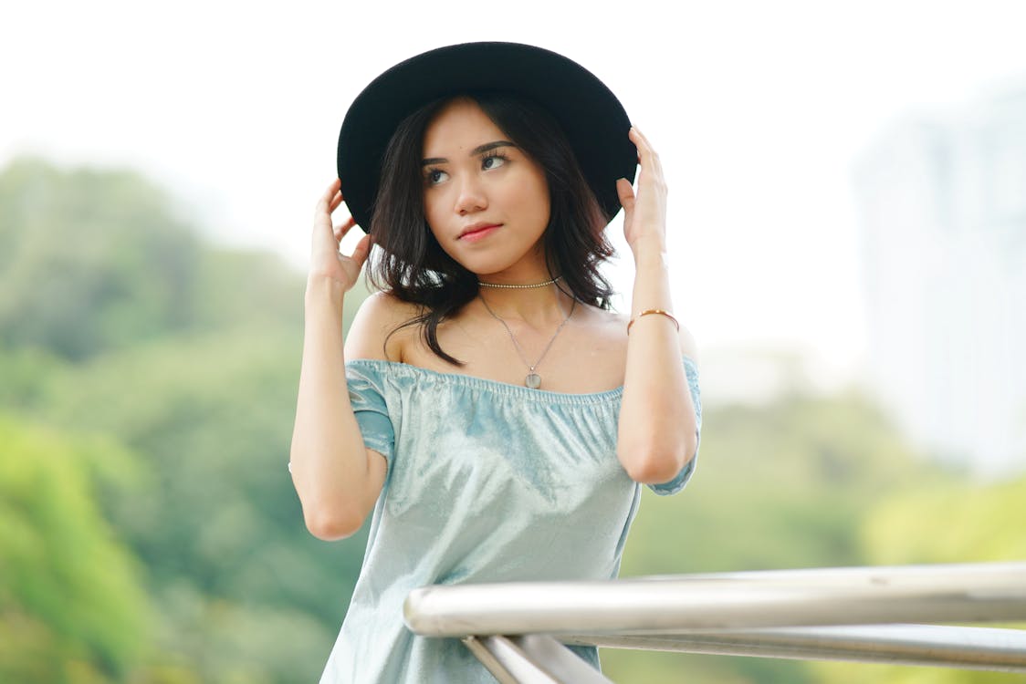 Free Women's Teal and White Off-shoulder Top Close-up Photography Stock Photo