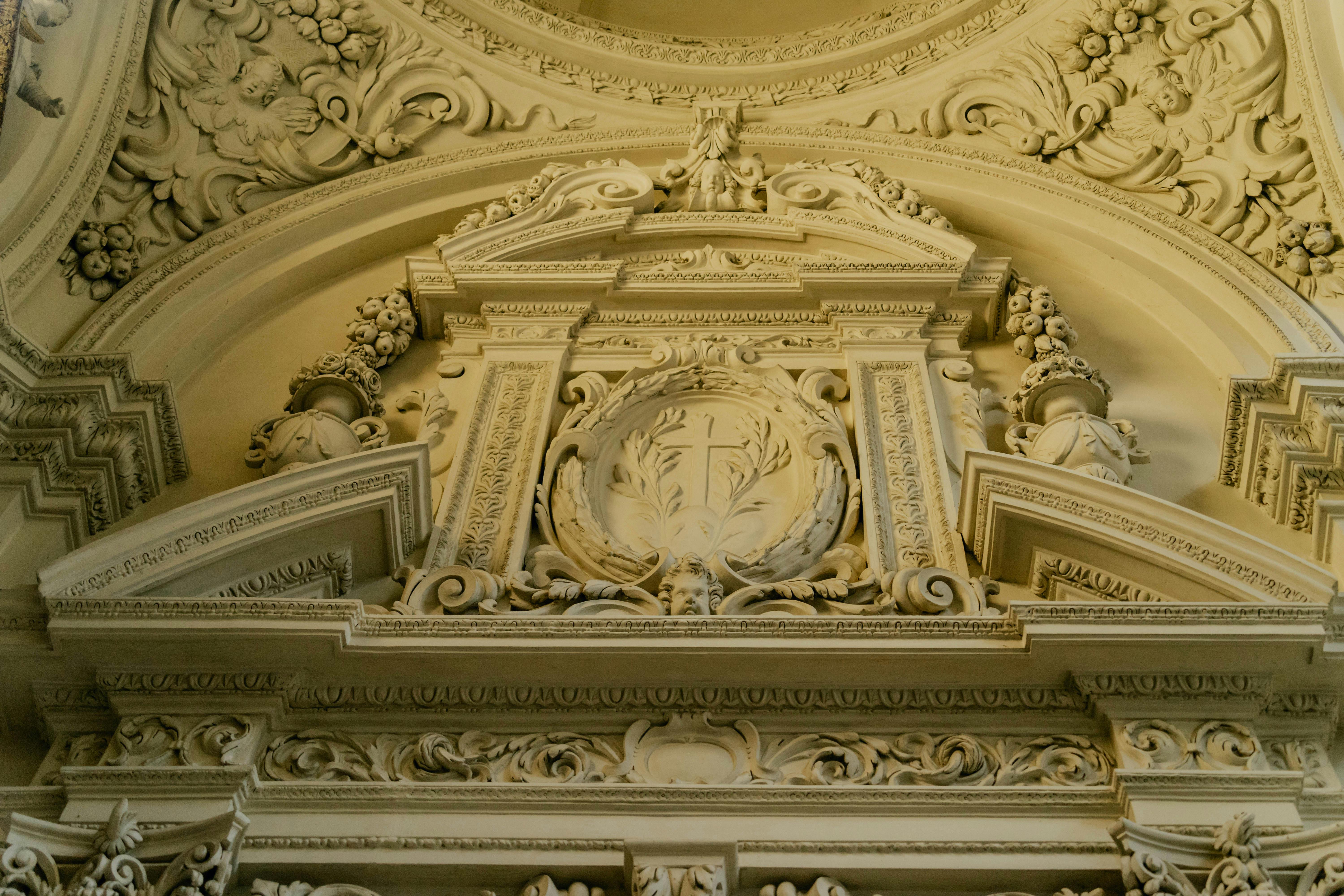 the ornate ceiling of a building with a clock