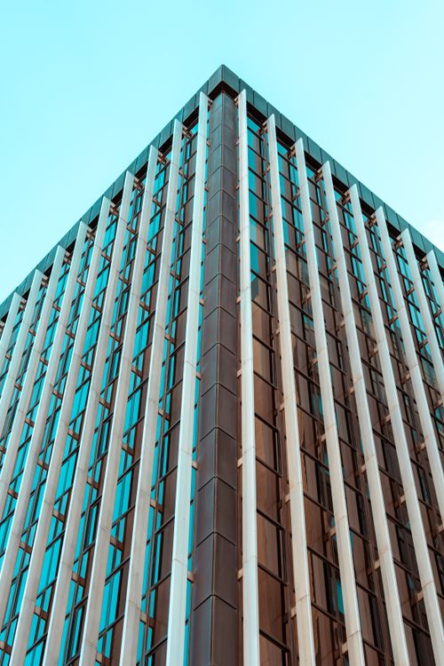 Free Corner view of a contemporary glass skyscraper in Madrid, showcasing modern architecture. Stock Photo