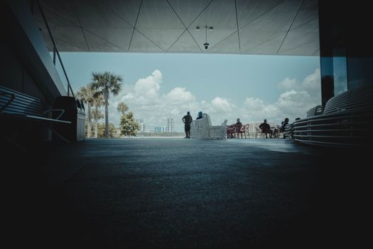 A modern urban scene with people by the waterfront in St. Petersburg, Florida.