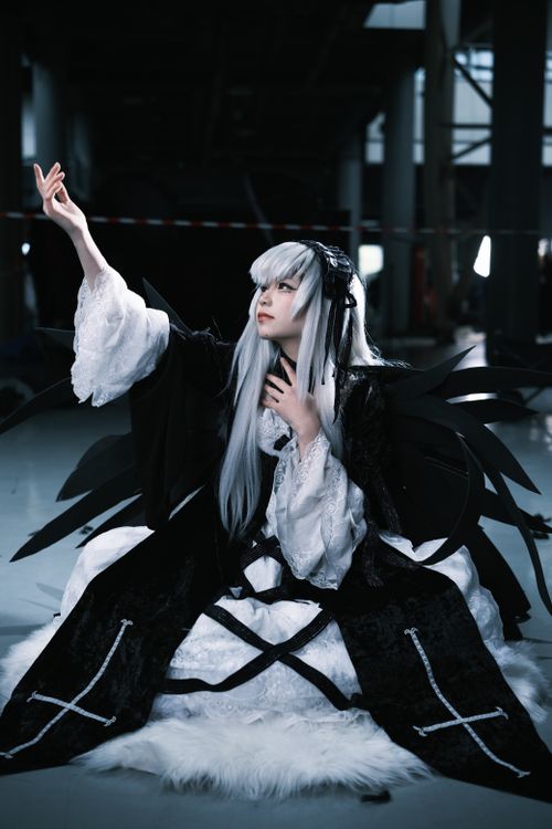 Free A dramatic cosplay photo featuring a woman in dark fantasy attire indoors. Stock Photo