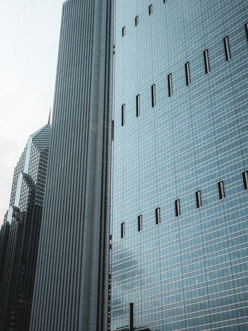 Free Dynamic view of towering skyscrapers with modern glass architecture. Stock Photo