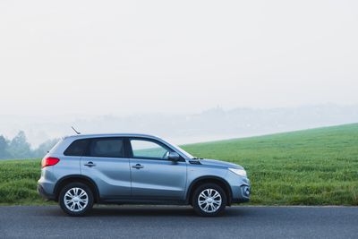 Silver crossover on a foggy country road — photo by Stepan Vrany on Pexels