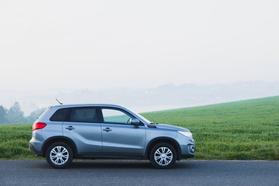 Silver SUV parked on a foggy countryside road — photo by Stepan Vrany on Pexels