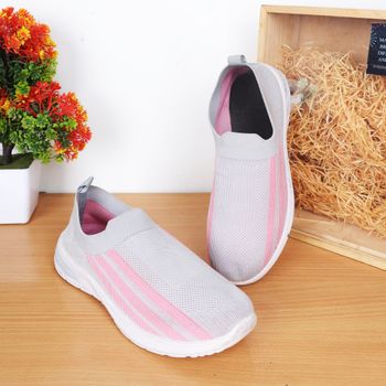 Elegant women's sneakers with pink stripes on a wooden surface, perfect for casual fashion.（イメージ）