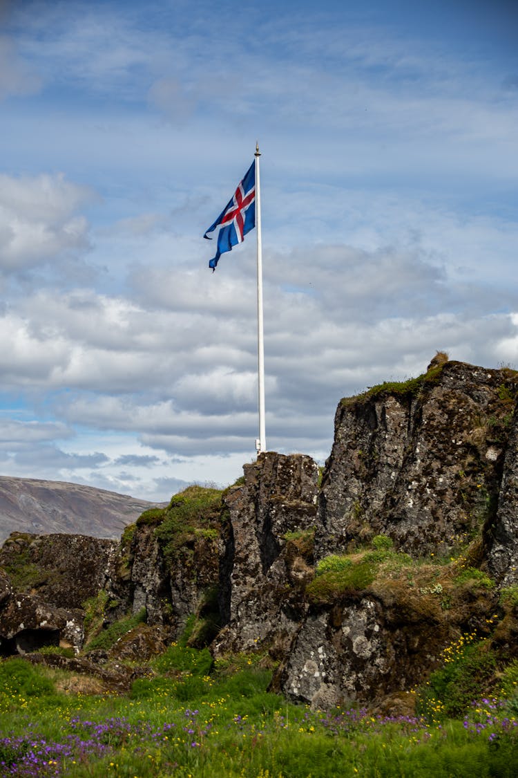 Flag Of Iceland On A Mountain