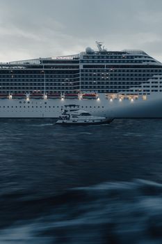A cinematic view of a cruise ship sailing on the Bosphorus at blue hour, capturing urban and marine elements.