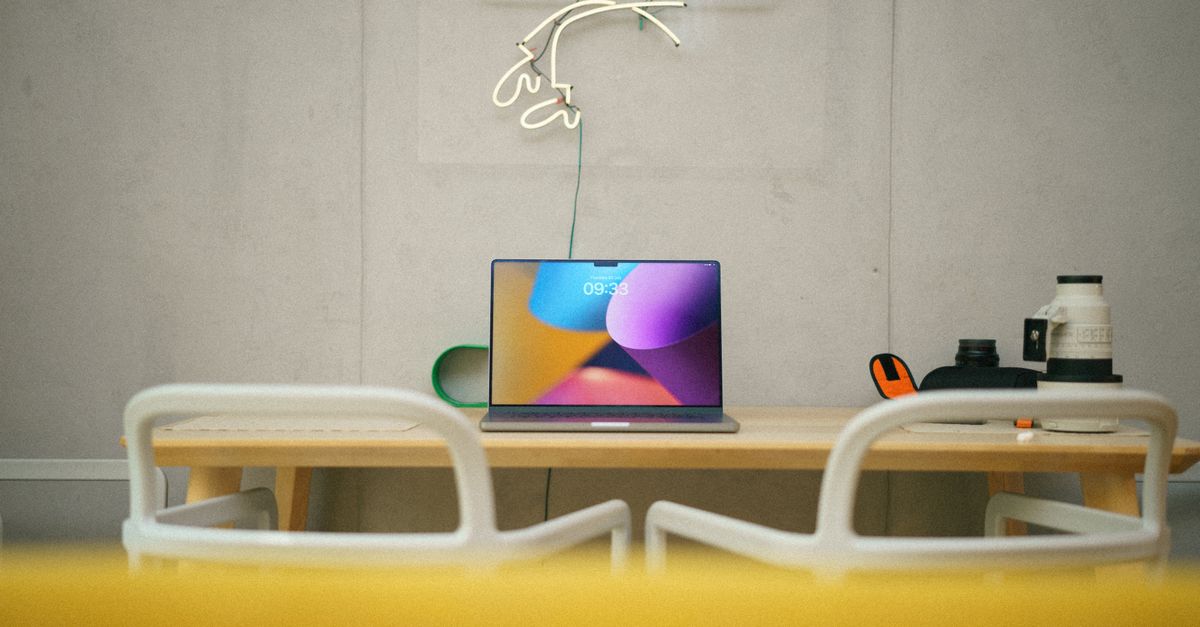 Bright, balanced listing photo of a home interior displayed on a laptop screen