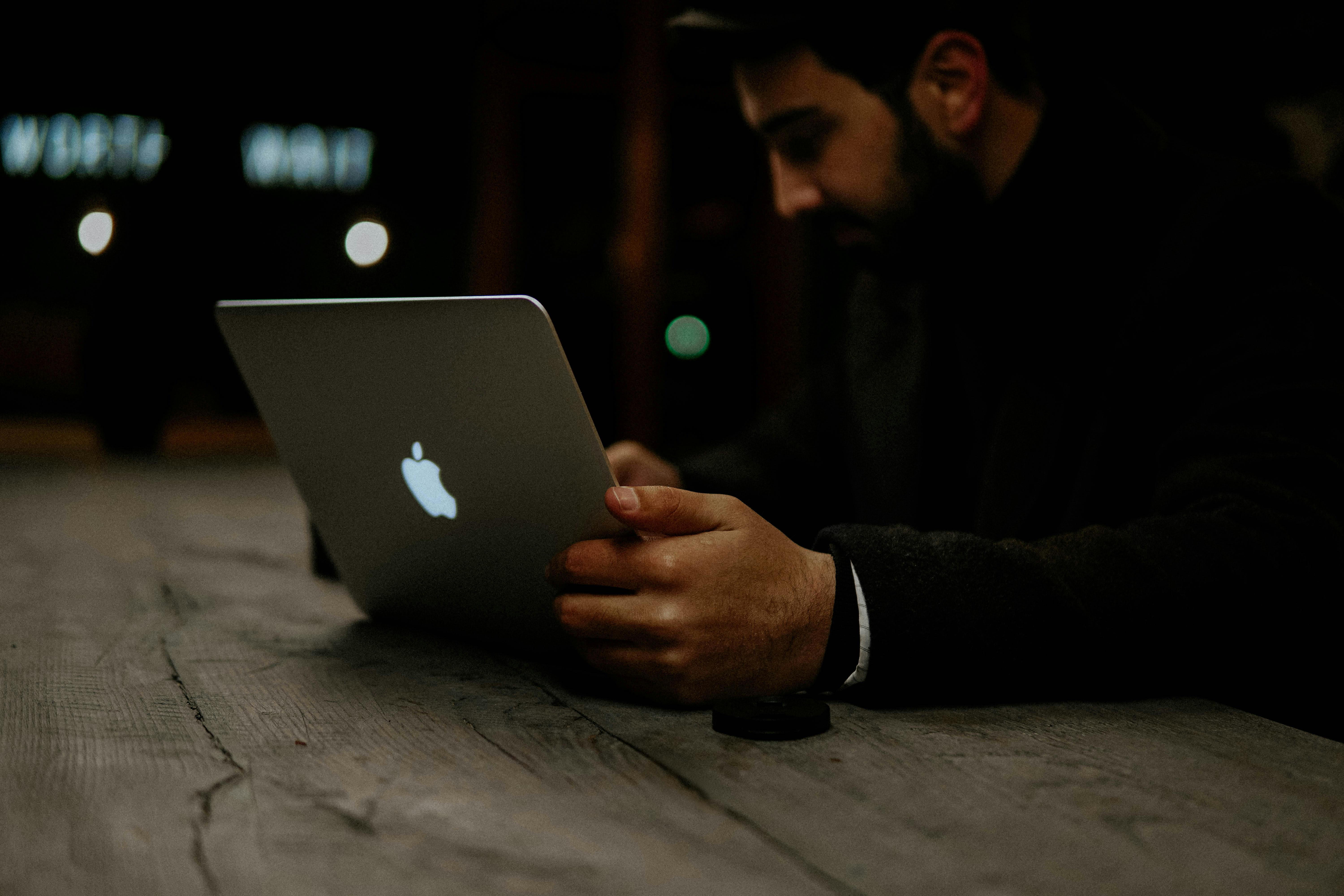 Photo of Man Using Macbook