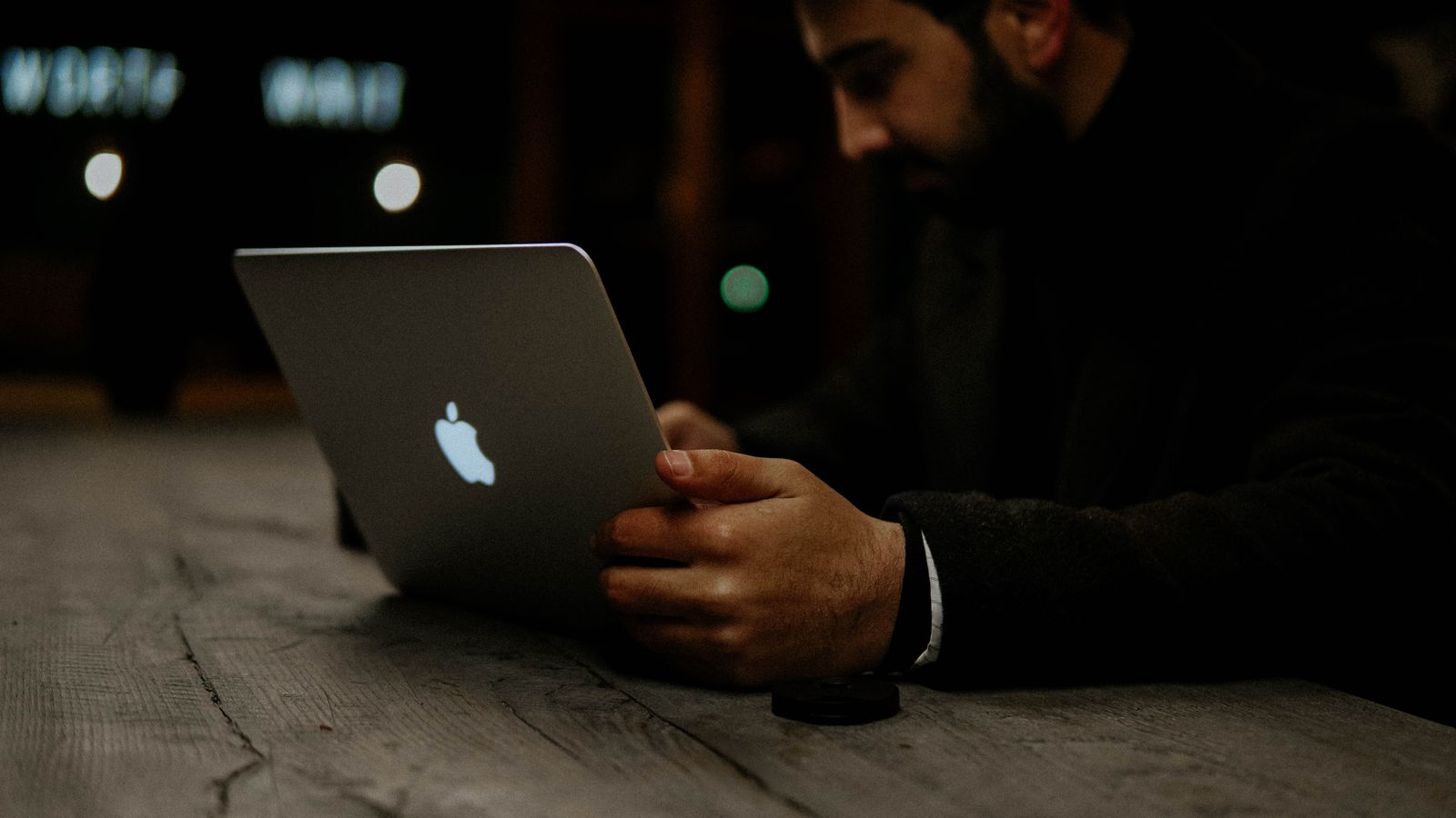 A founder working alone on a laptop at night