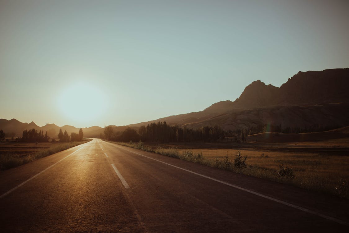 Free Empty Road With View Of Sunset Stock Photo