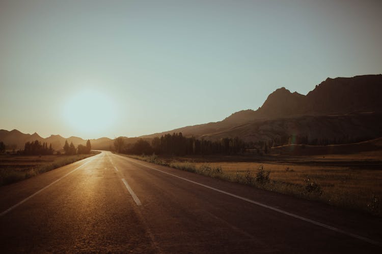 Empty Road With View Of Sunset