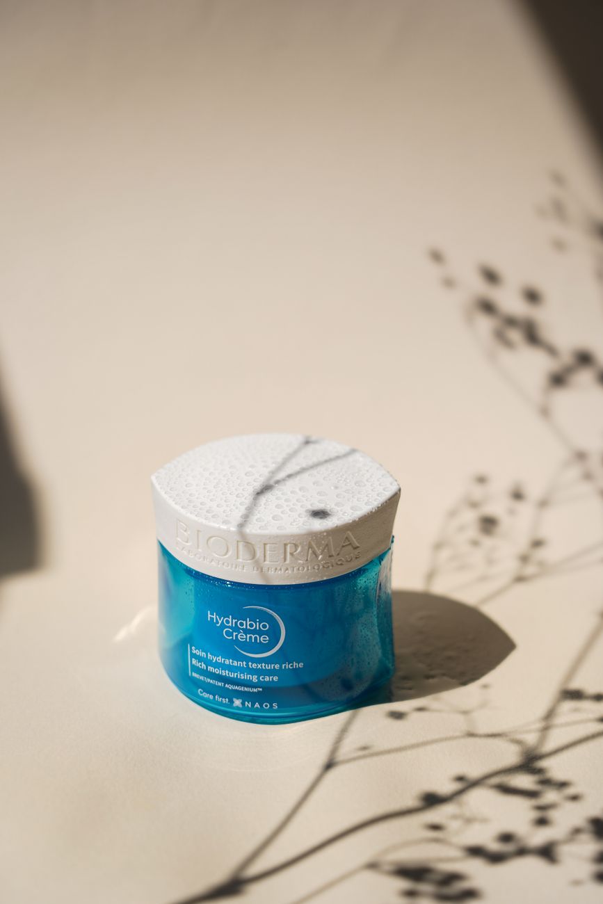 Minimalist photo of Bioderma Hydrabio Crème moisturizer with artistic lighting and shadows.