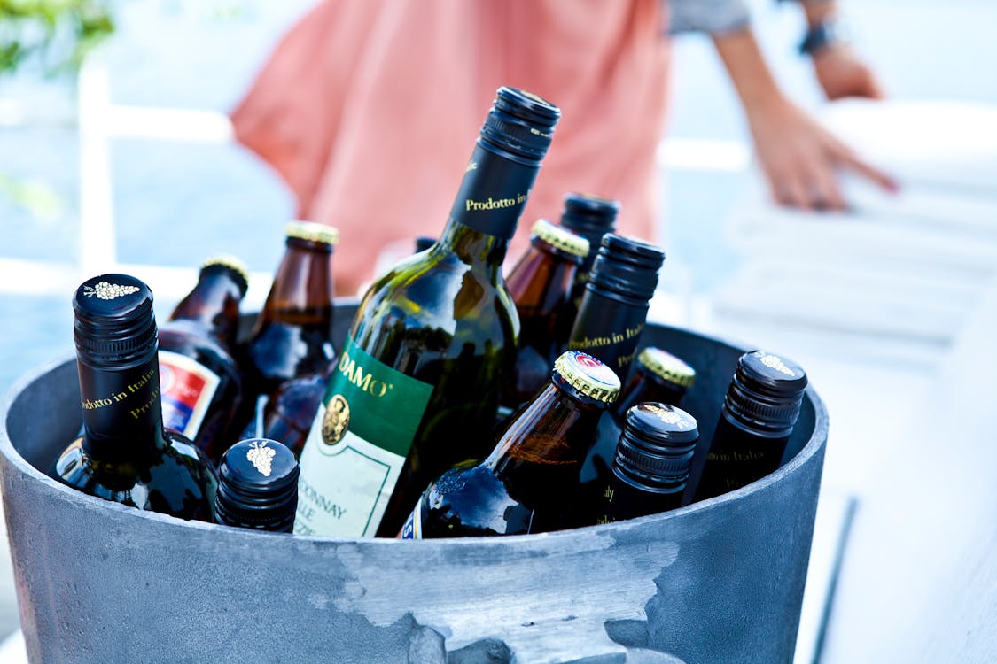 Free Liquor Bottles in Gray Bucket Stock Photo