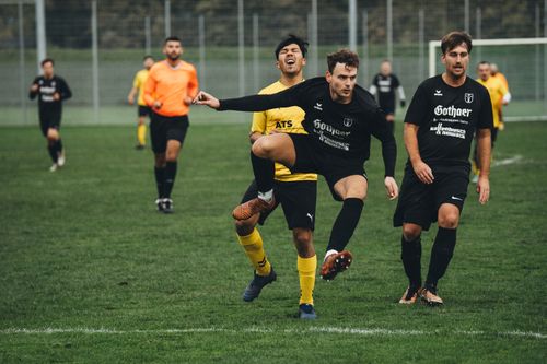Free Dynamic shot capturing the excitement of a competitive soccer match with players in action. Stock Photo