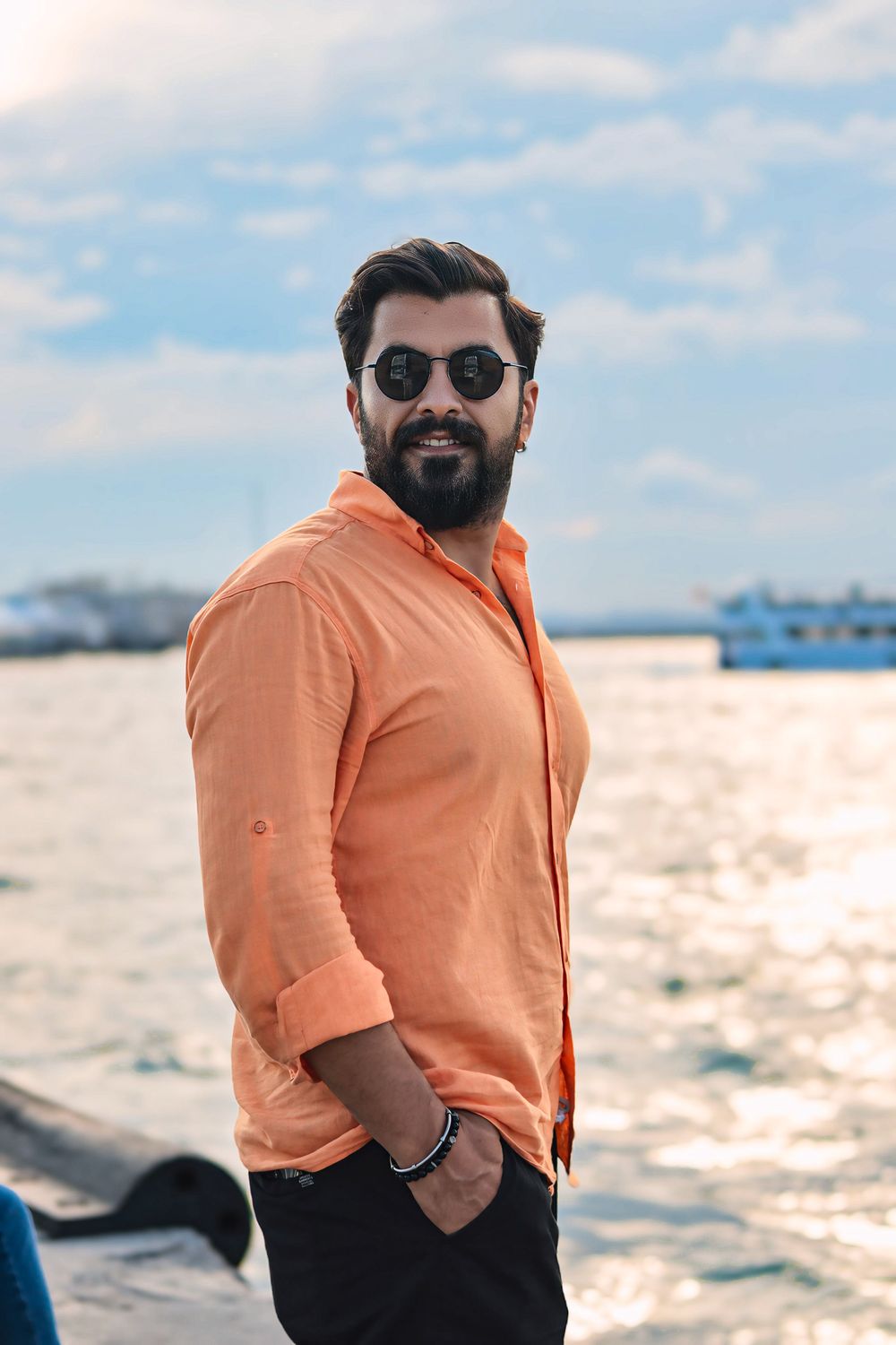 Man in Orange Shirt on the Promenade · Free Stock Photo