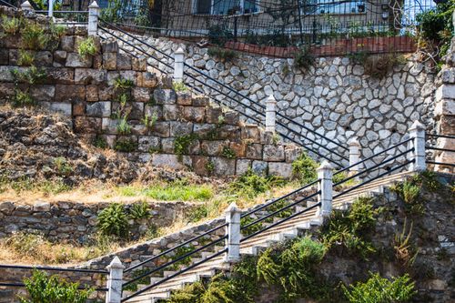 Free A historic stone staircase adorns a scenic outdoor hillside landscape. Stock Photo