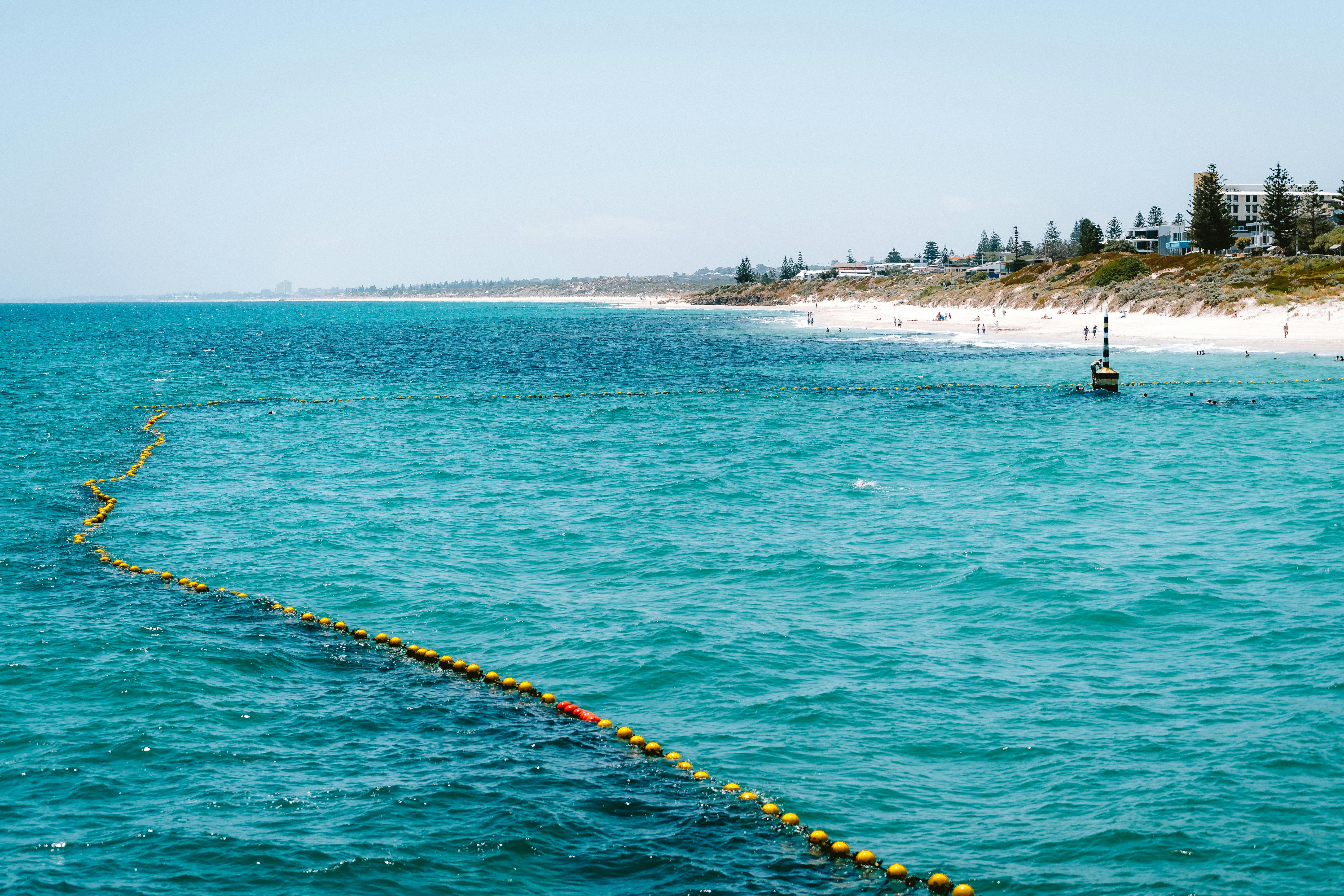 Clear turquoise waters at Cottesloe Beach, Australia, with a shoreline view. Perfect for leisure and travel inspiration.