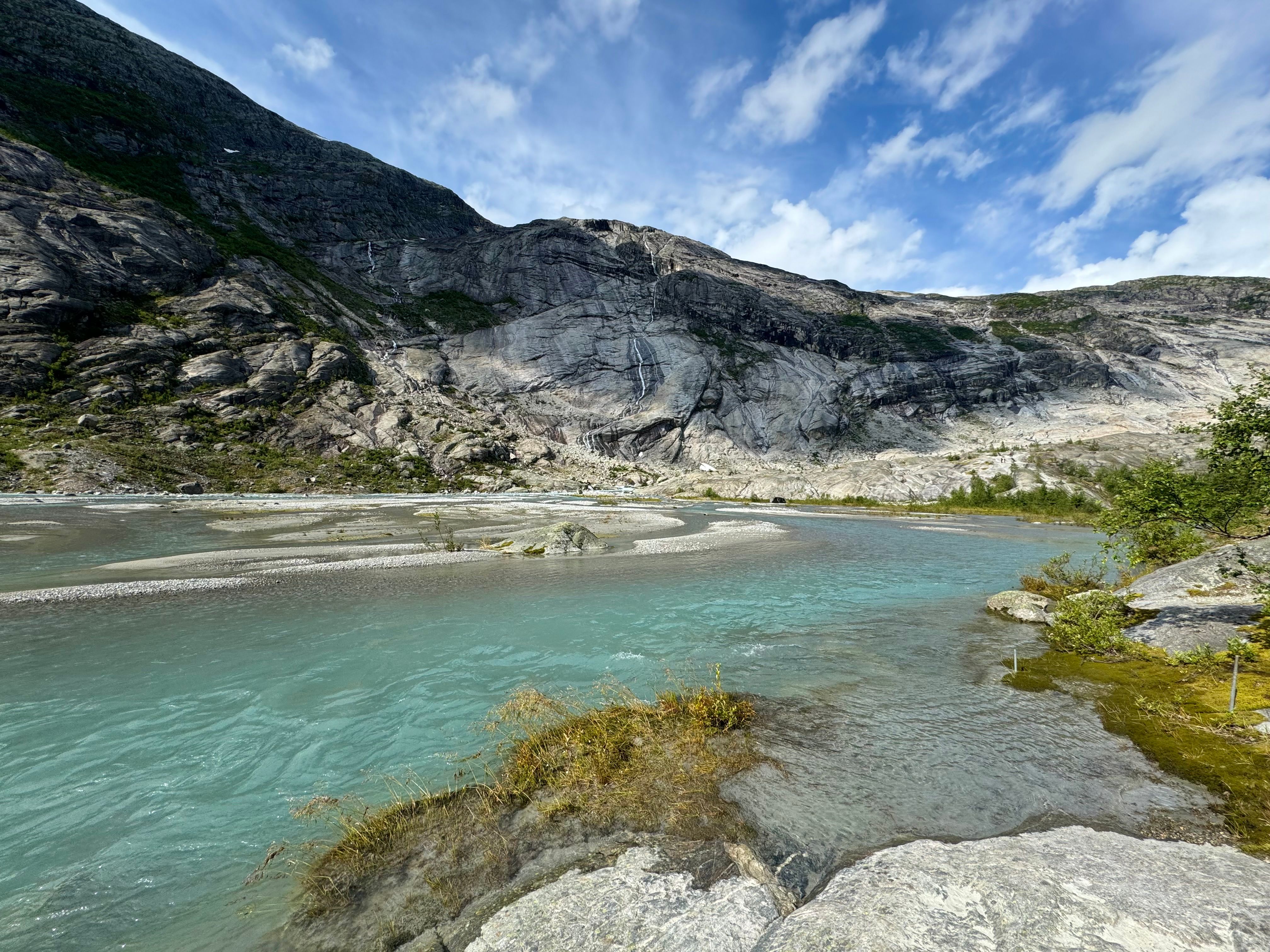 A river is flowing through a rocky landscape · Free Stock Photo