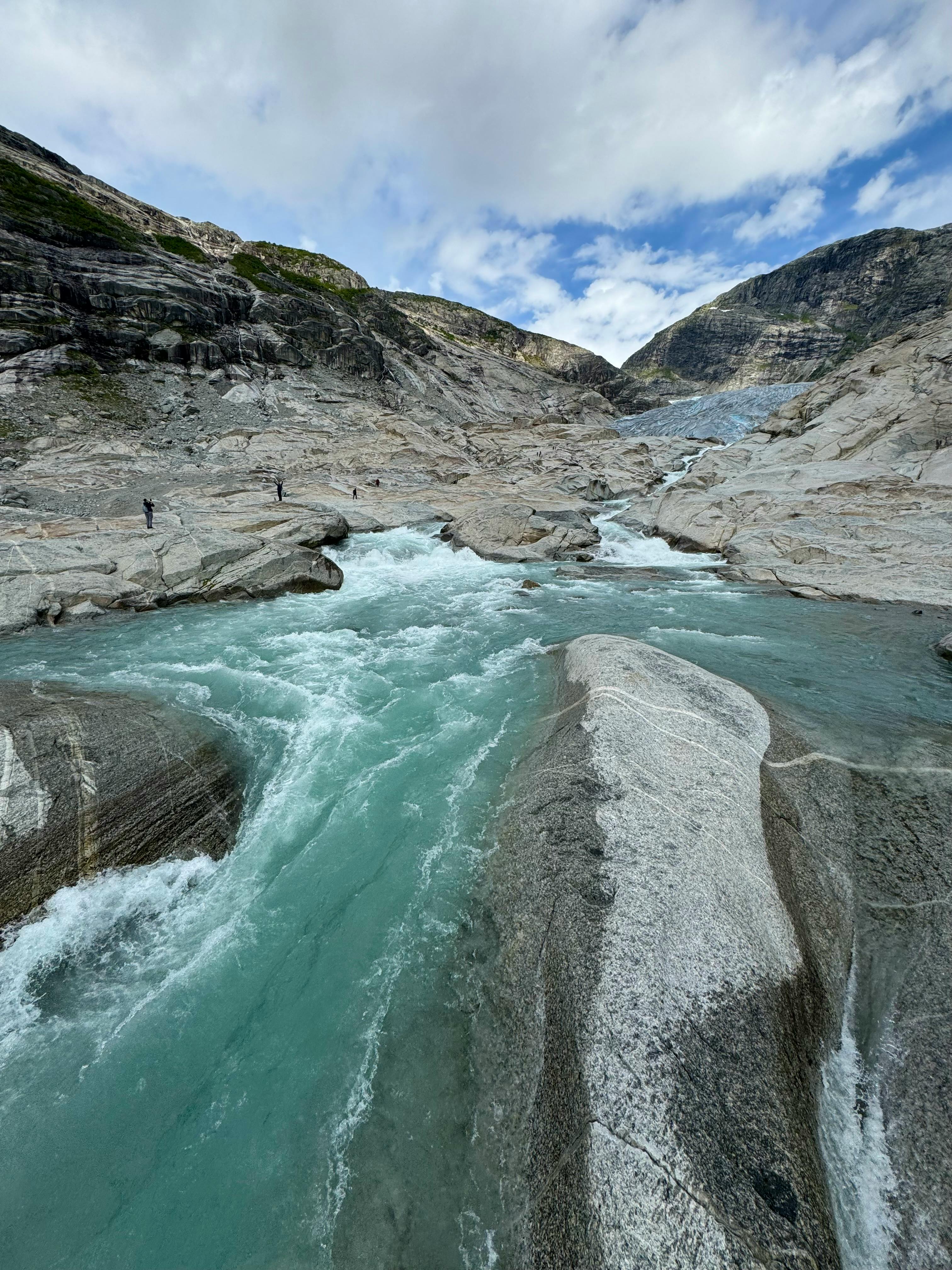 a river flowing through a rocky canyon