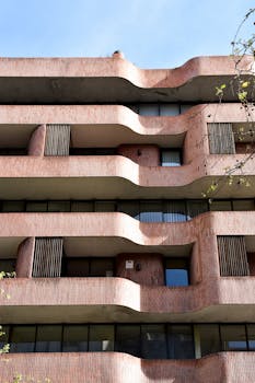 Unique modern architecture in Barcelona showcasing curved brick design elements.
