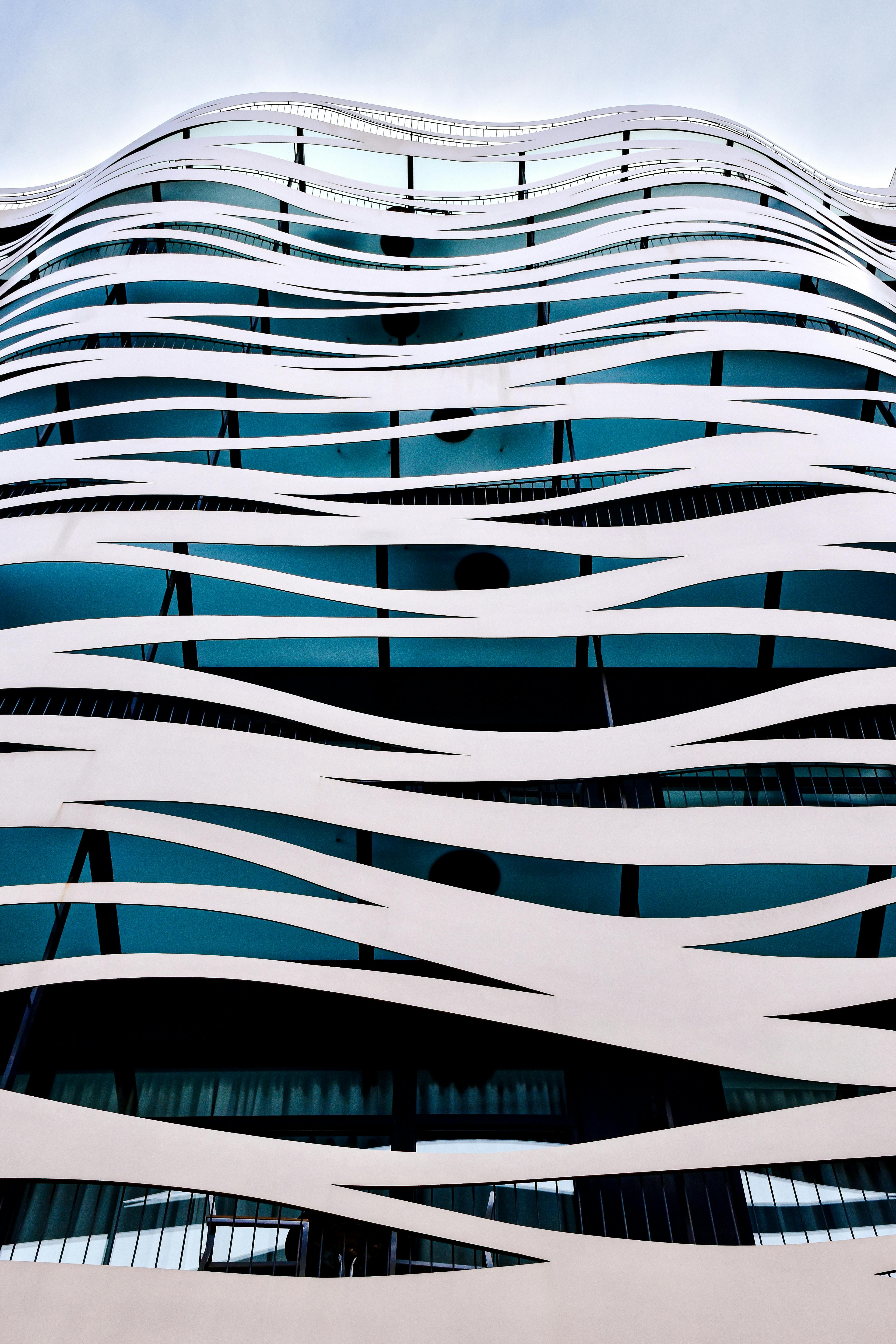 a building with a curved design that looks like waves