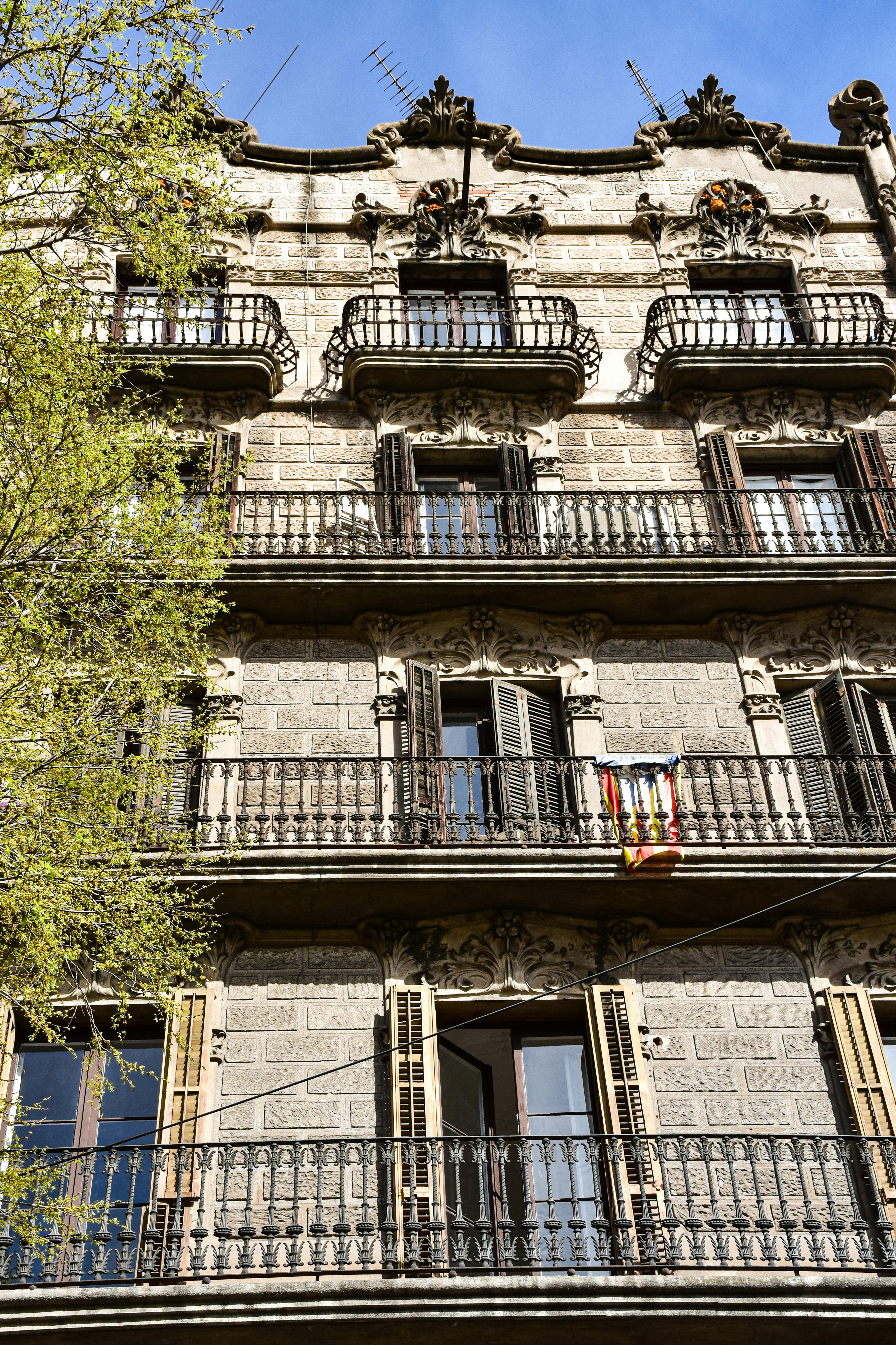 a building with balconies and balconies on the top