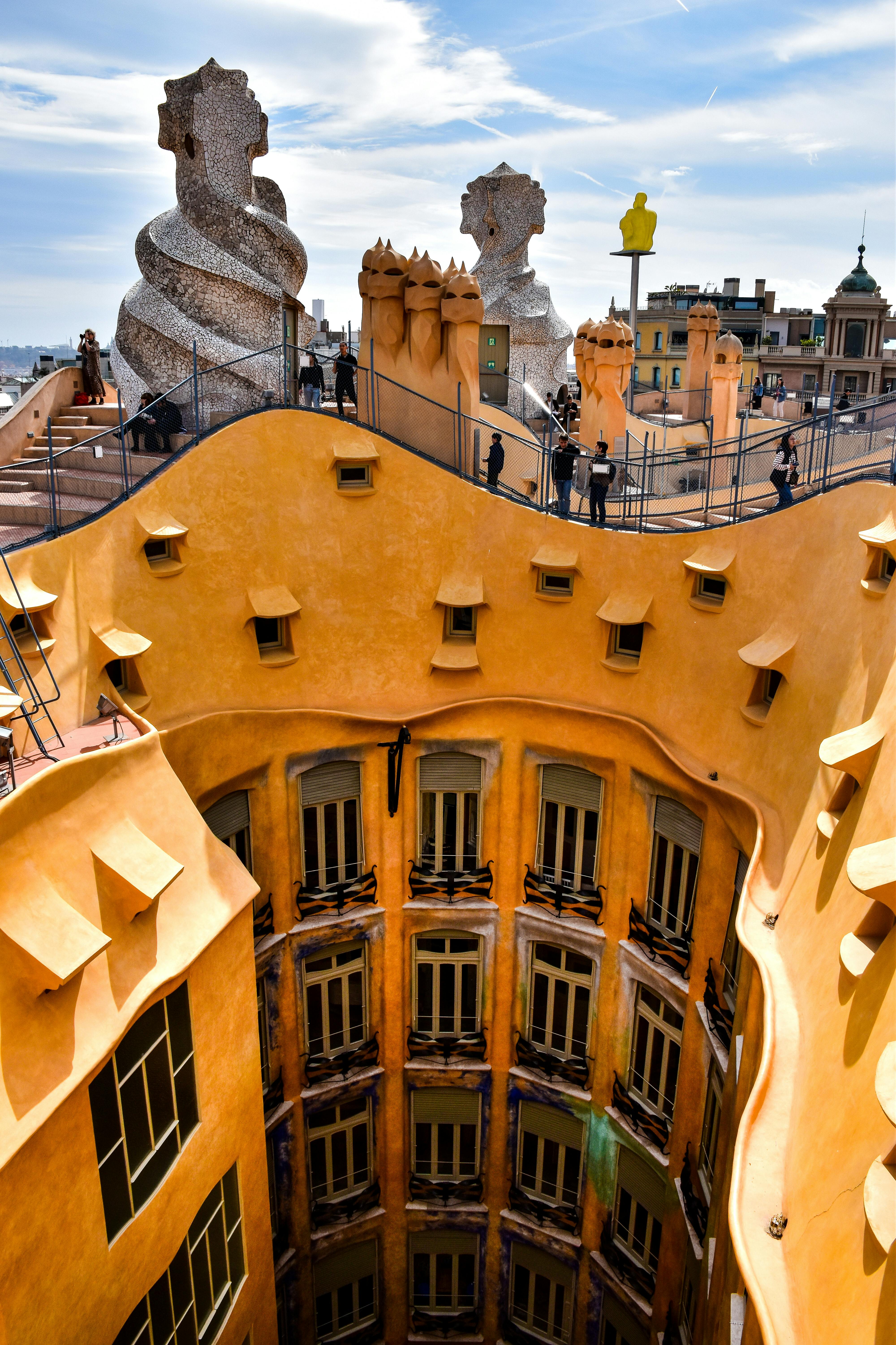 the roof of a building with statues on it