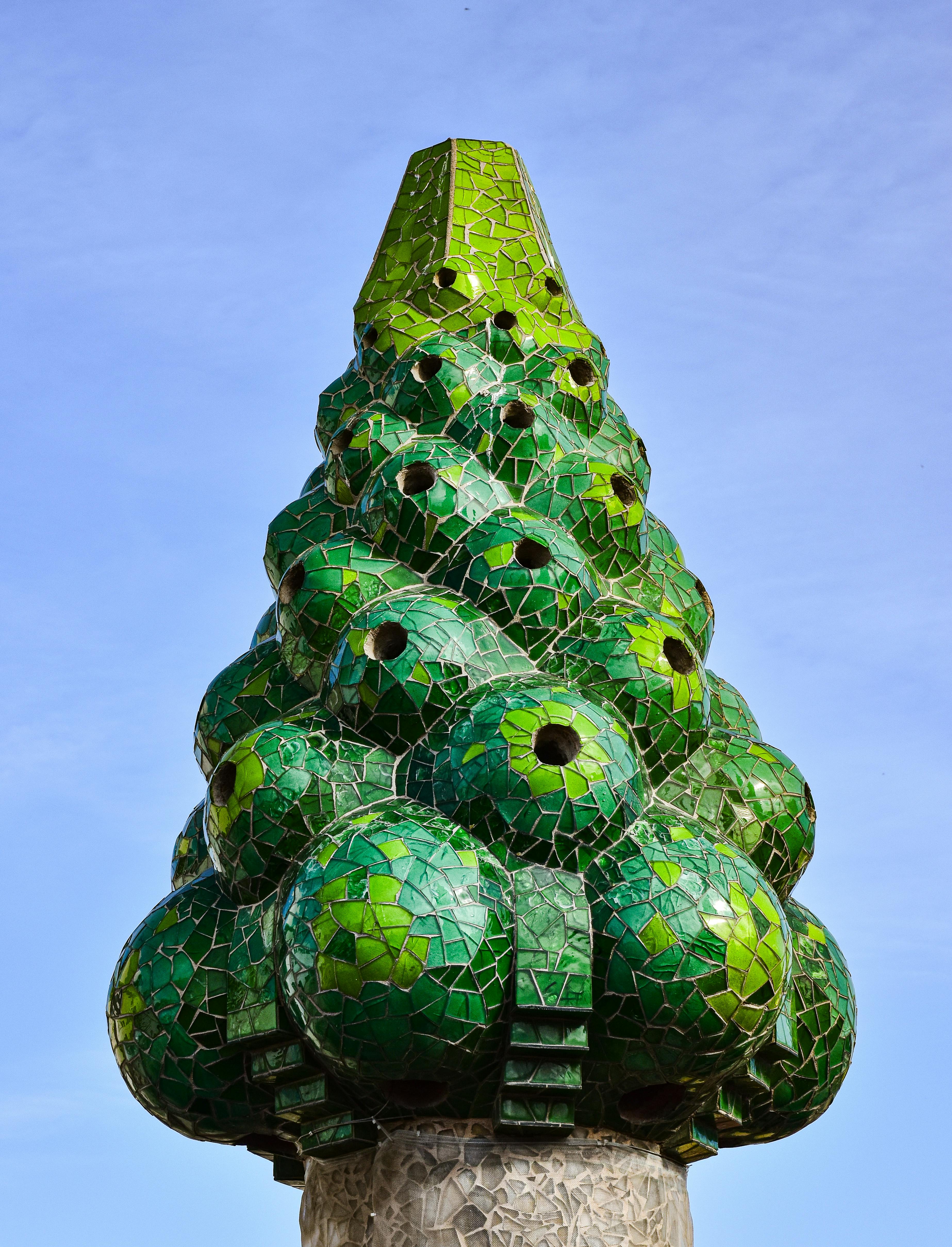 a green and green tree shaped like a cone