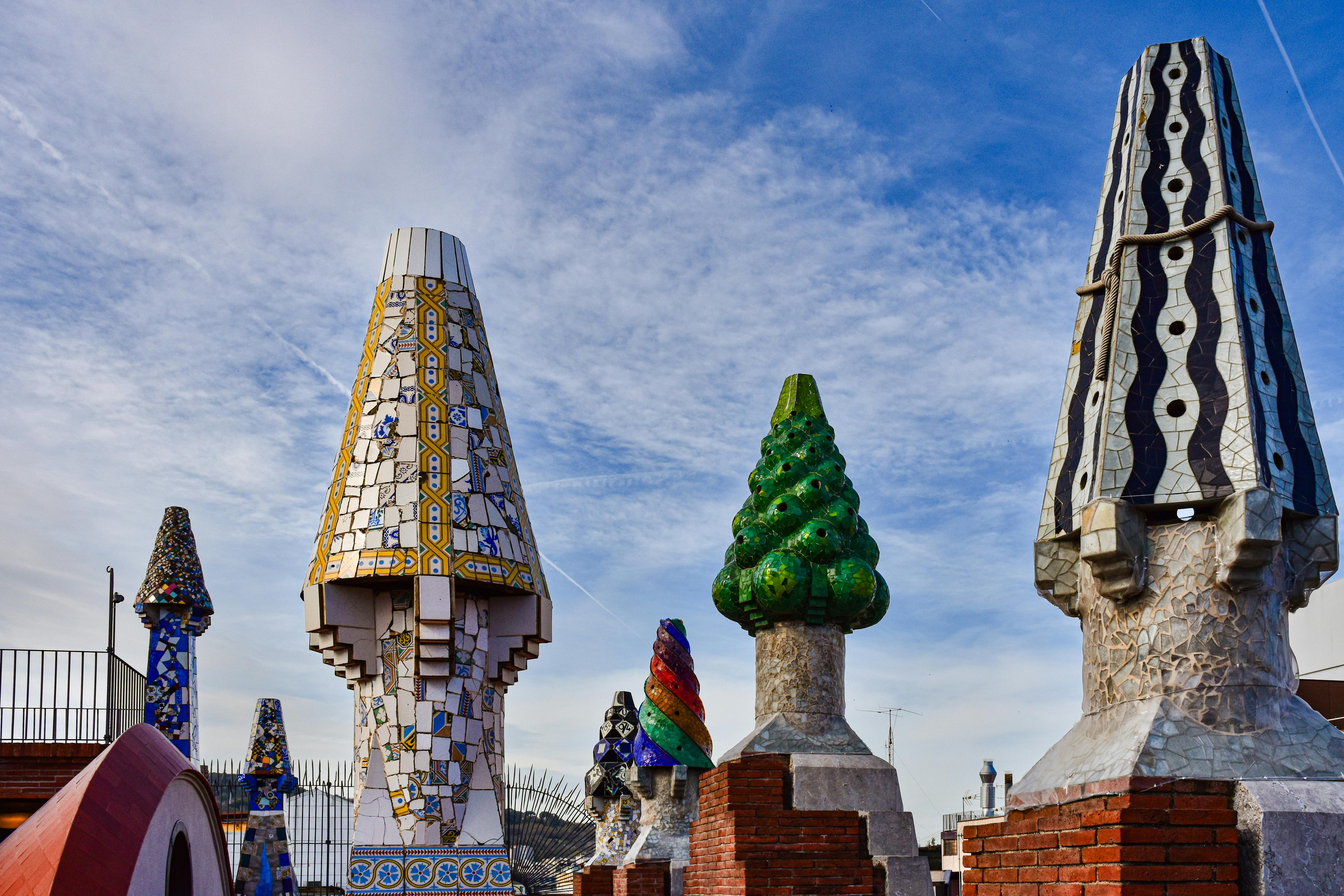 a row of colorful statues in a park