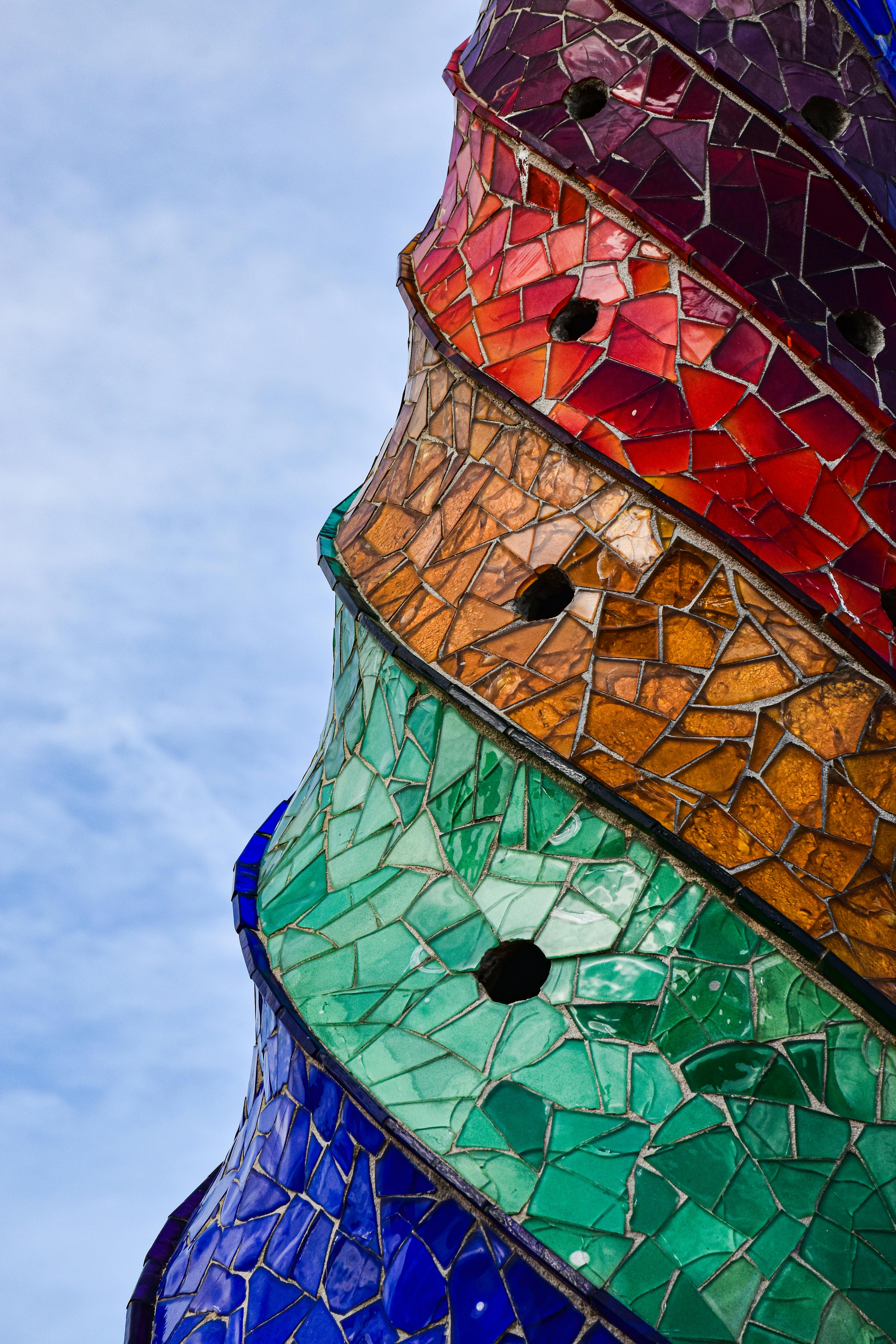 a colorful sculpture with a blue sky in the background