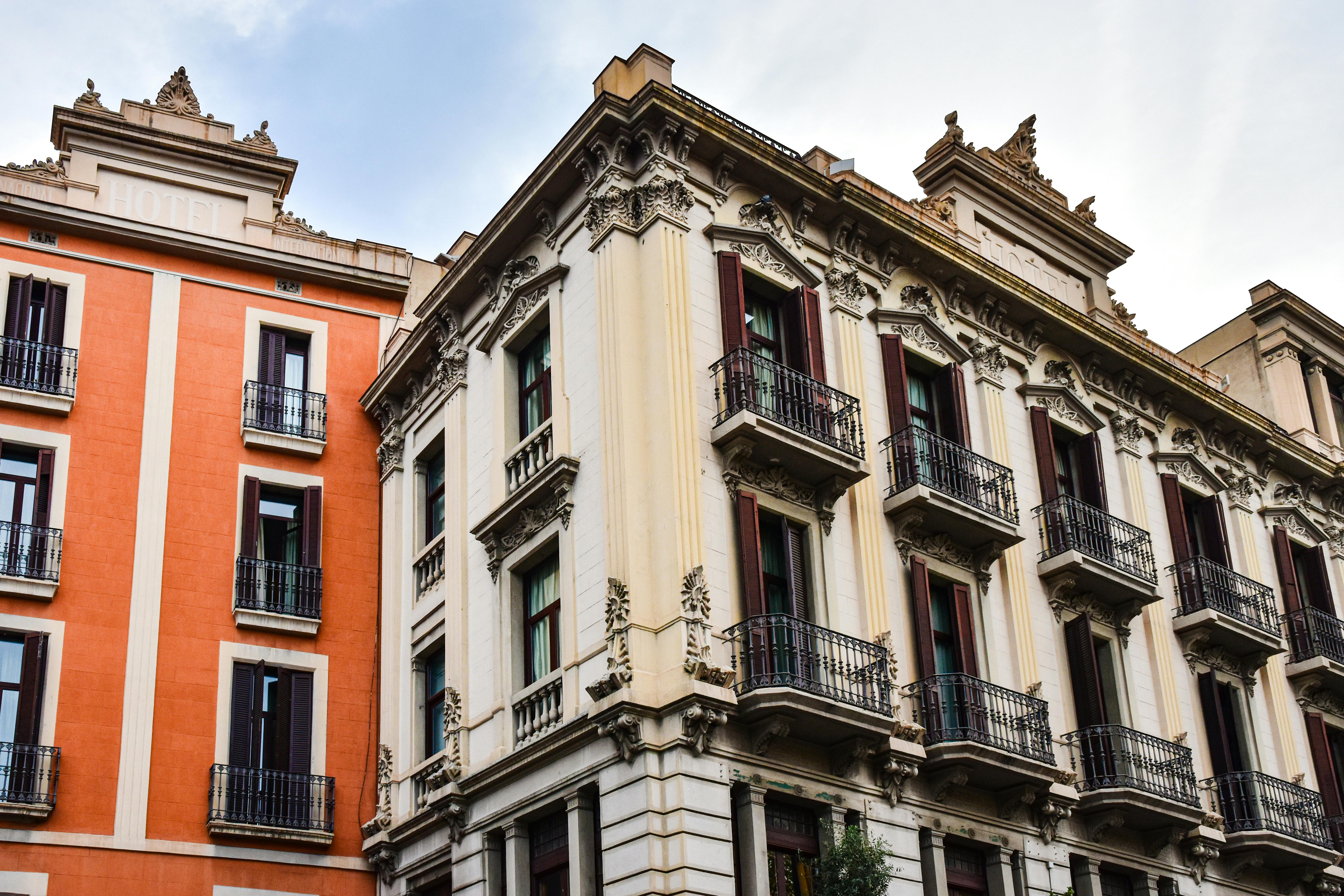 a building with balconies and windows on the side