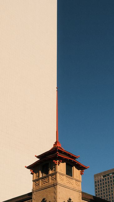 A vibrant capture of traditional architecture in San Francisco's Chinatown with a modern city backdrop.