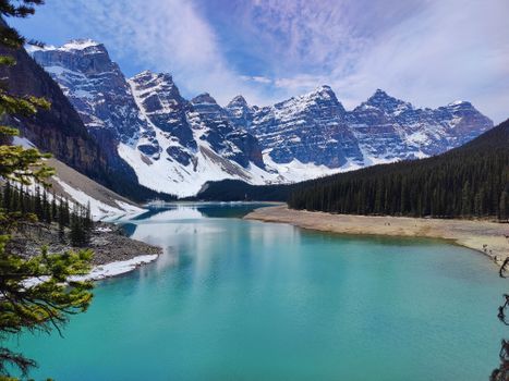 Beautiful alpine scenery of Moraine Lake in Banff National Park with turquoise waters and snowy peaks.