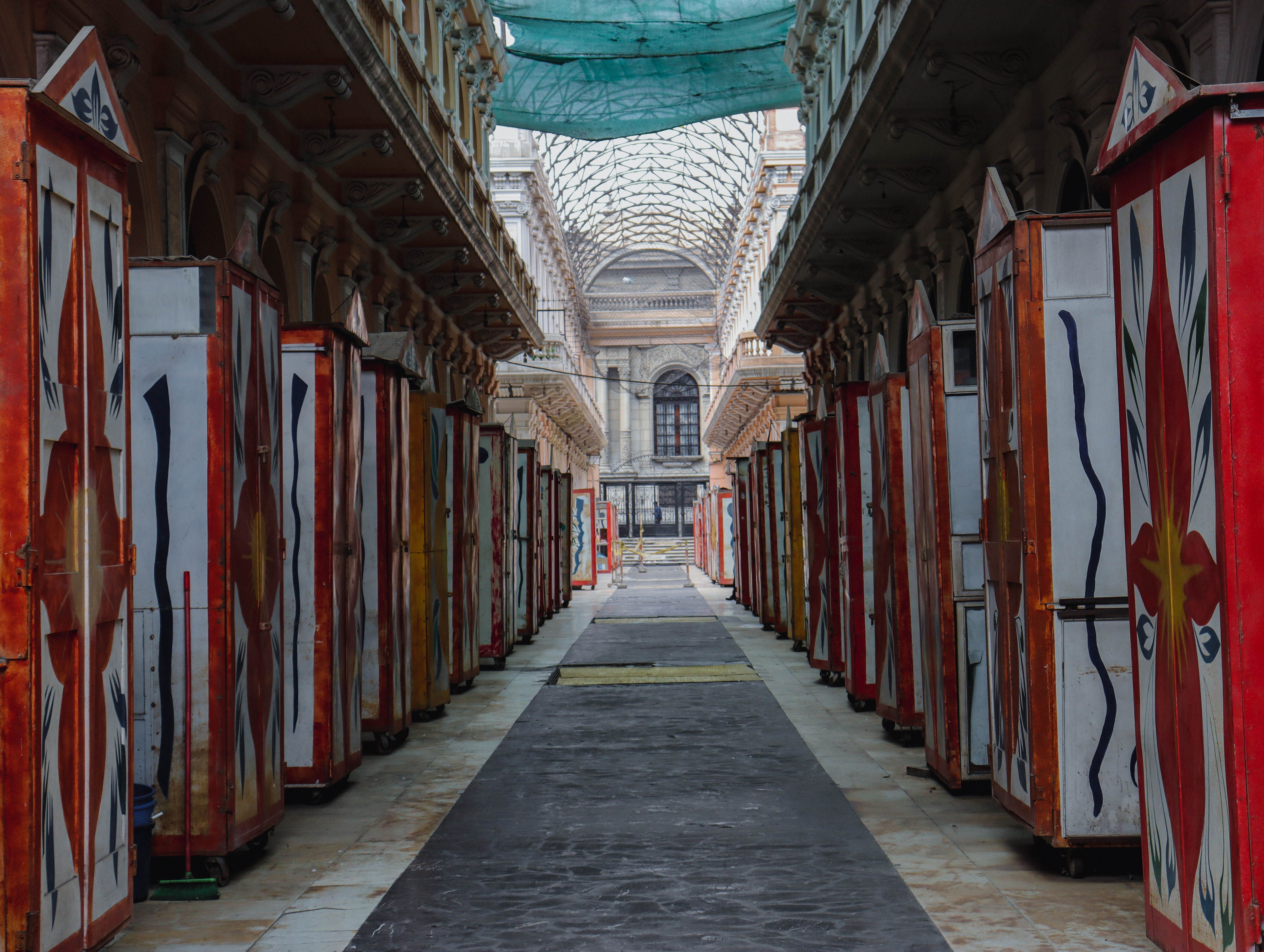 A long hallway with many colorful doors · Free Stock Photo