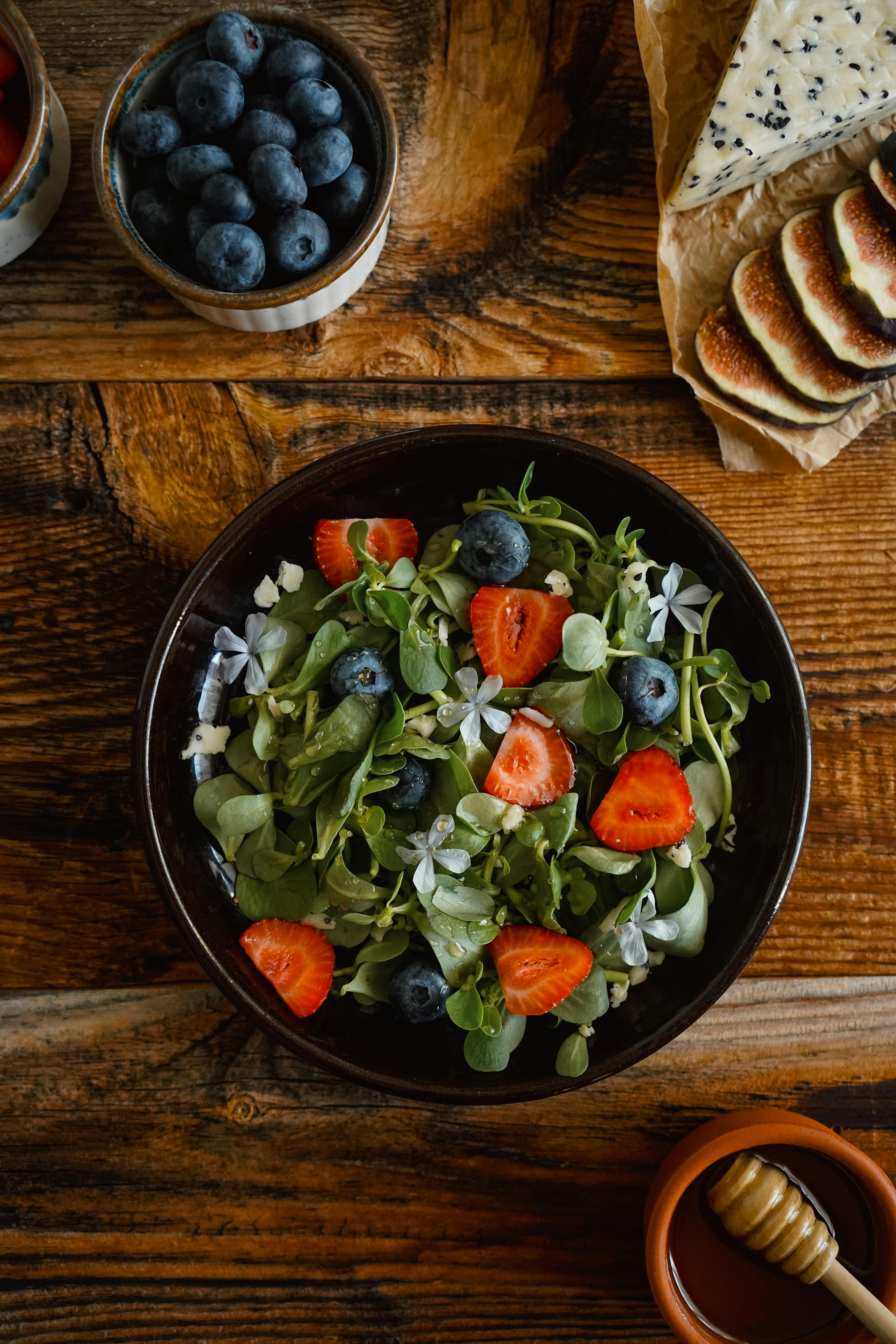 Free Organic Salad with Strawberries, Blueberries, Herbs and Edible Flowers Stock Photo