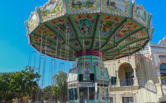 Photo: Emilio Sánchez Hernández on Pexels Colorful vintage carousel in a sunny amusement park with ornate design.