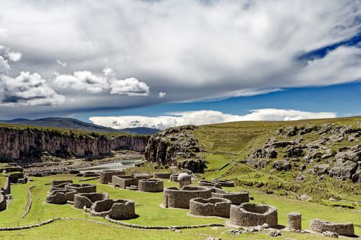 Explore the stunning ancient ruins in Espinar, Cusco, Peru, under a dramatic sky.