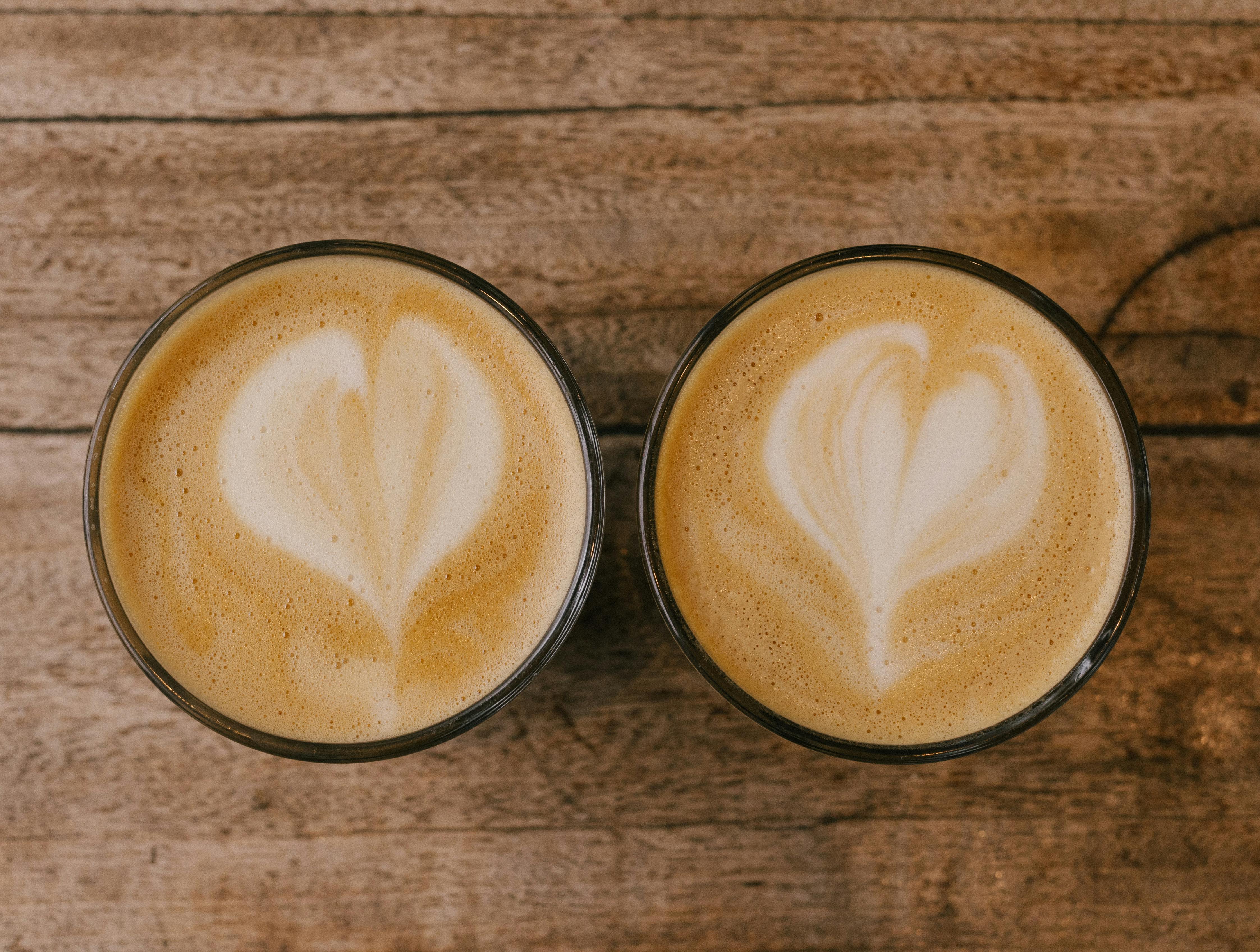 latte and cappuccino side by side showing different foam levels - latte vs cappuccino