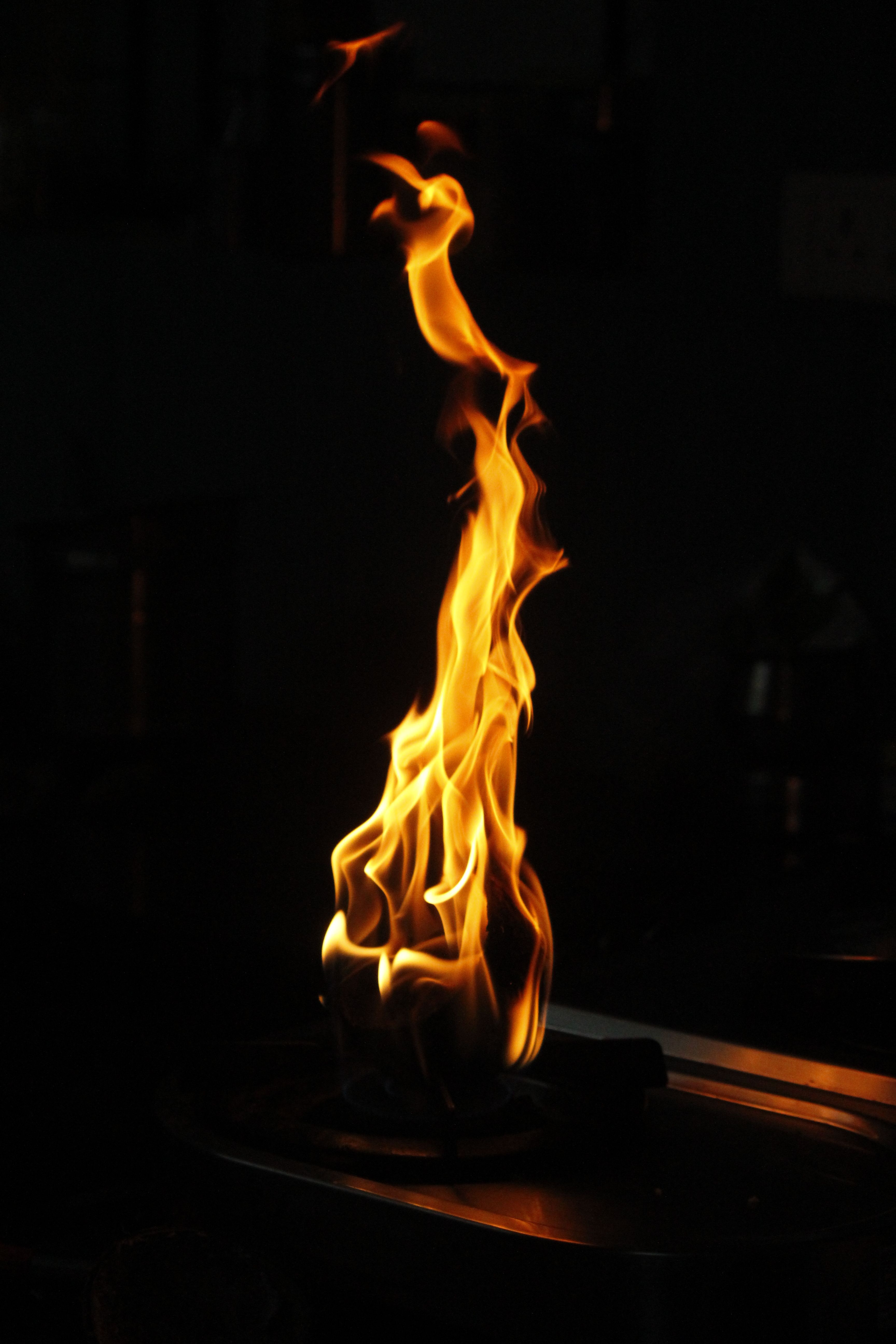 A captivating close-up of flames illuminating the darkness, conveying warmth and energy.