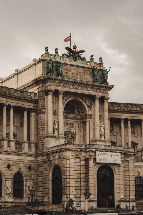 Free Front view of Hofburg Palace showcasing its historical architecture in Vienna, Austria. Stock Photo